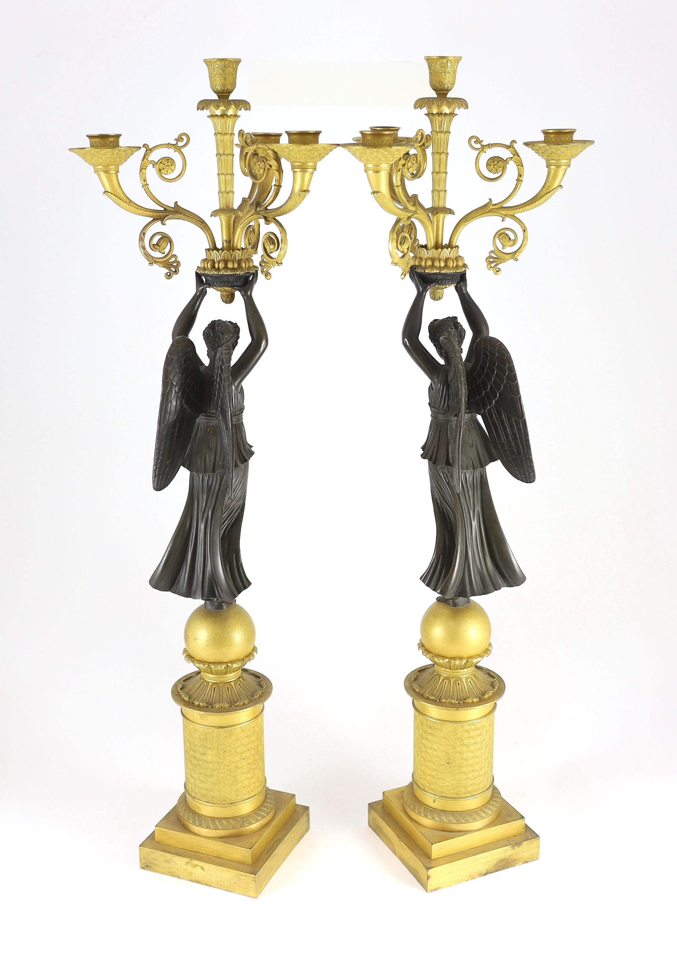 A pair of 19th century French Empire style bronze and ormolu four light candelabra, 21cm wide, 80cm high